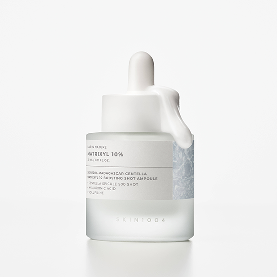 Skincare ampoule bottle with text on a white background