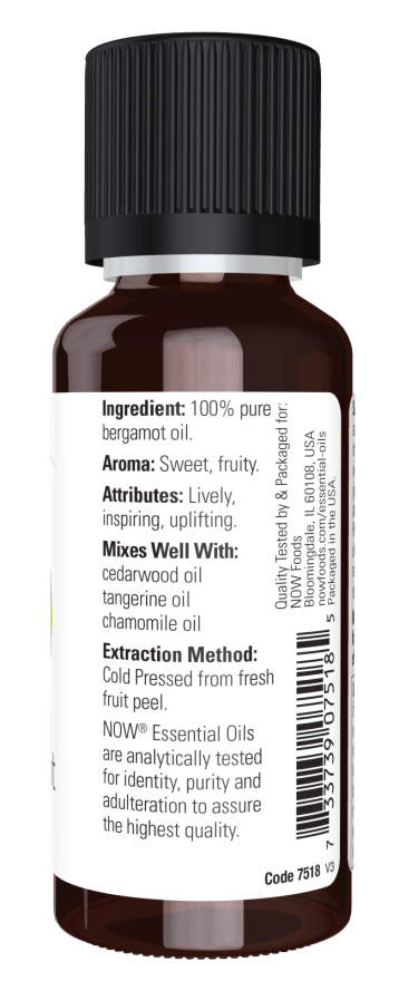 Bottle of bergamot oil with label on a white background